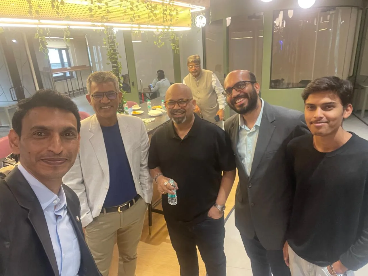 Group photograph with industry professionals at a co-working venue